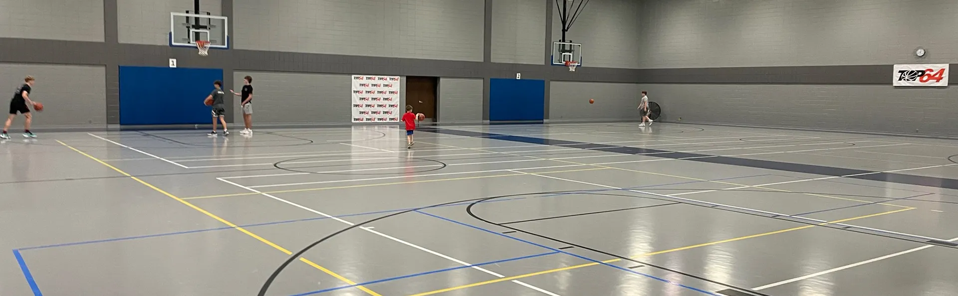 A basketball court with players in action.